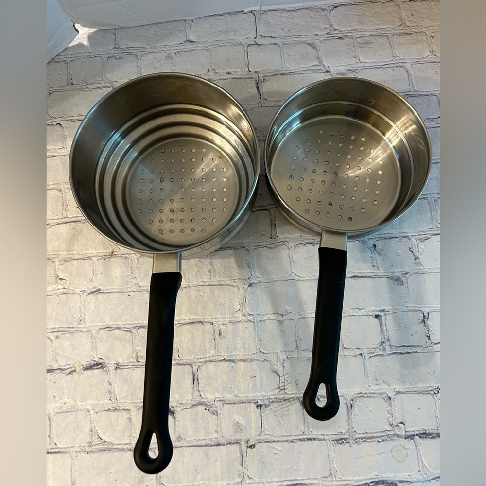 SET OF TWO STAINLESS STEEL STEAMER POTS WITH BLACK HANDLES